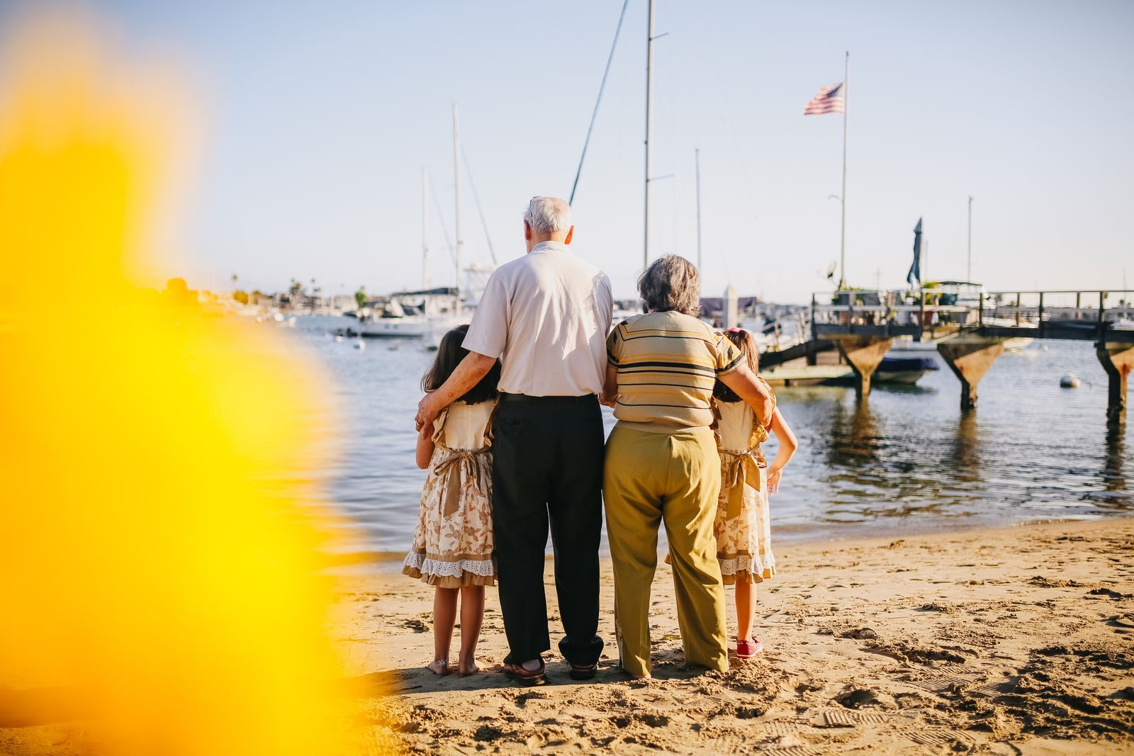 Grandparents and grandchildren on a beach, reflecting cruise trends 2026 toward multigenerational trips